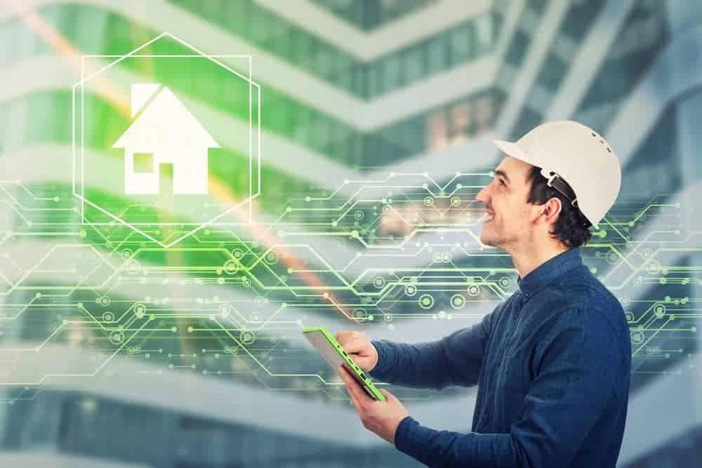 The AI Marketing Advantage Only 1.4% of Contractors Are Using 1 A man in a hard hat uses a tablet, smiling towards a glowing house icon surrounded by digital circuits. The image conveys innovation in smart technology.